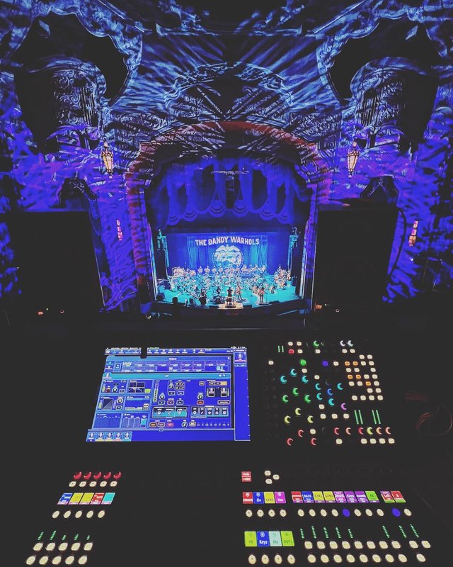 Entertainment technology setup with professional audio equipment and lighting controls
